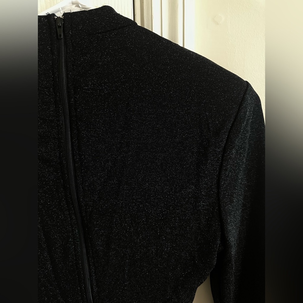 New dress with price tag. Top has cutter part , bottom is draped. Feels small - Picture 5 of 5